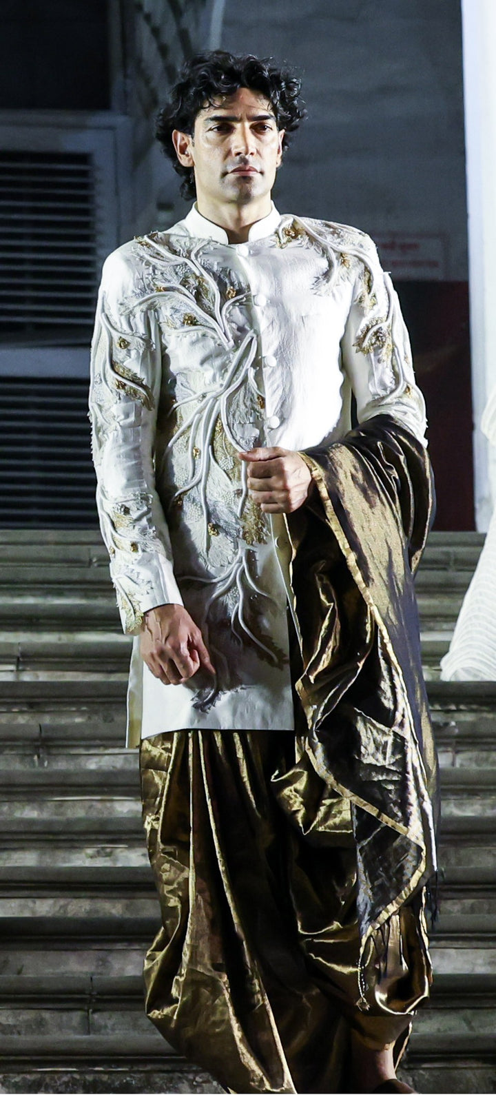 CORAL SHERWANI AND DRAPED SILK  DHOTI SET